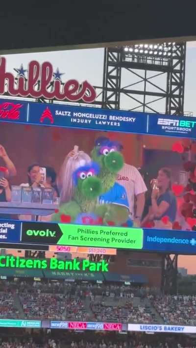 The Phillie Phanatic gets caught in a ColdPlay Kiss Cam moment.