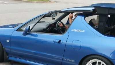The power-retracting targa roof on a Japanese market Honda CRX Del Sol