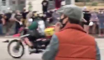 Protester in Aurora, CO, opened fire on a Jeep that tried to pass through the crowd blocking a highway. He hit two fellow protesters