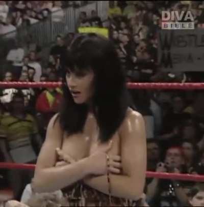 The Kat Flashing Her Breasts after Terri Runnels ripped her top off after the Kat defeated her in an arm-wrestling match, 