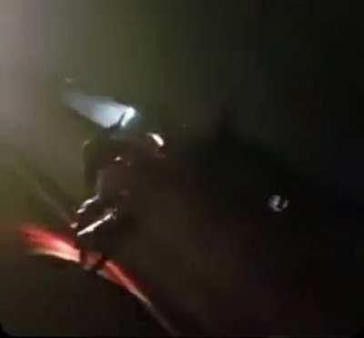 Speeding car doesn’t see biker doing wheelie