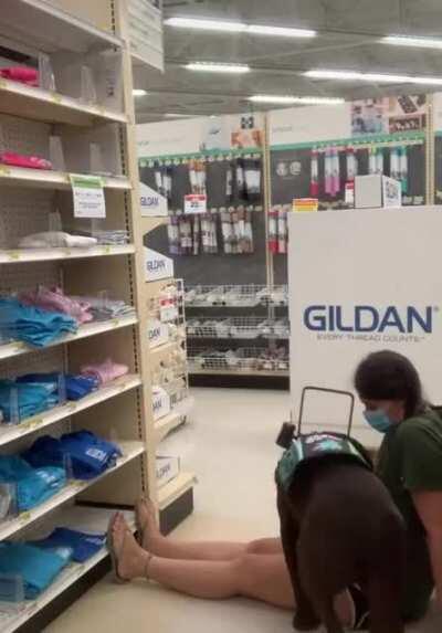 Dog tells owner to sit down as she is getting dizzy. The dog won't let her get up until she is back to normal to avoid a fall.