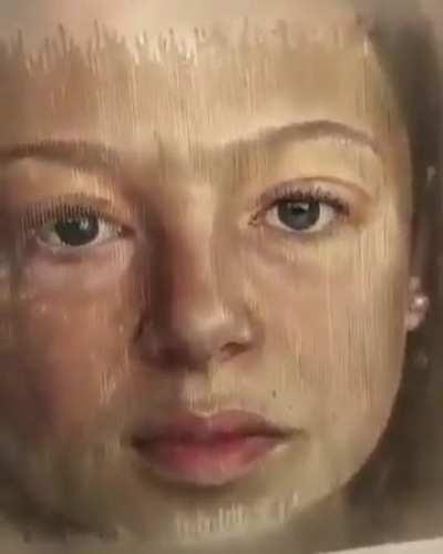 This is a painting by the Spanish painter Sergi Cadenas. It ages from the angle you look at it.