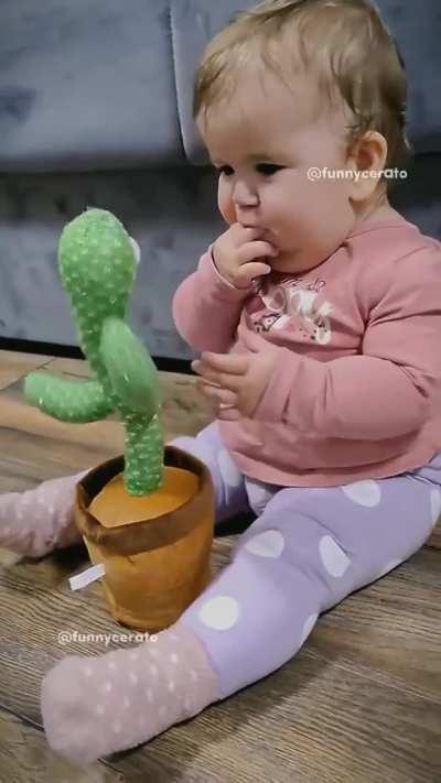 Baby with cactus toys
