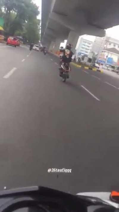 Wheelie to oncoming traffic