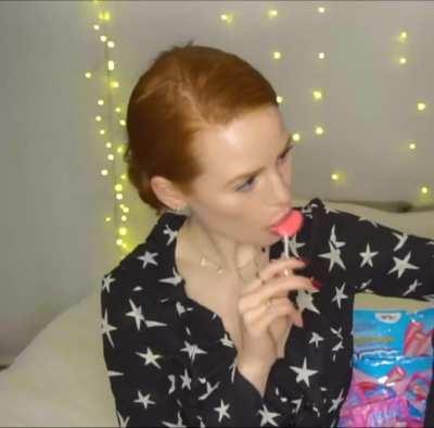 Madi eating a lollipop