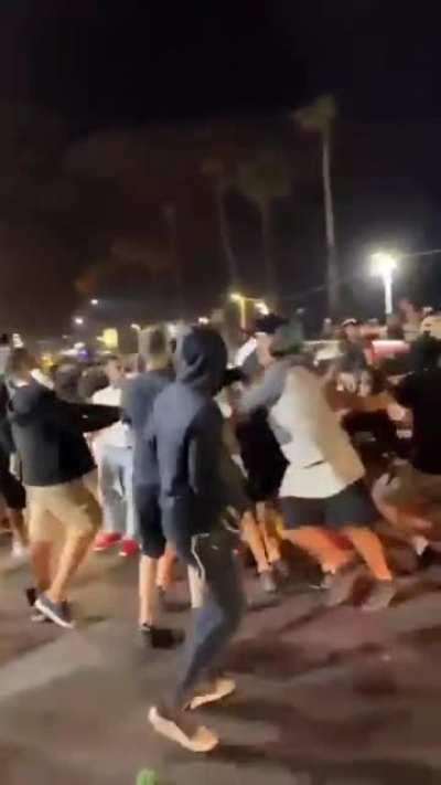 Mob pulls a man out of his car and lynches him.