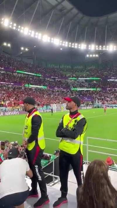 The reaction of a Moroccan security guard after he took a sneak peek at Hakimi's Panenka Penalty when Morocco knocked out Spain.