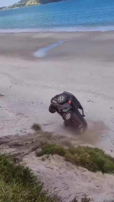 An idiot by the beach.. in a car..