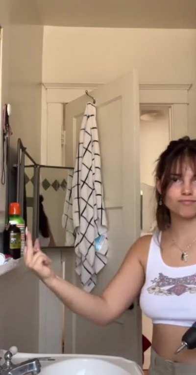 Inde putting shelf up in bathroom | TikTok July 2023