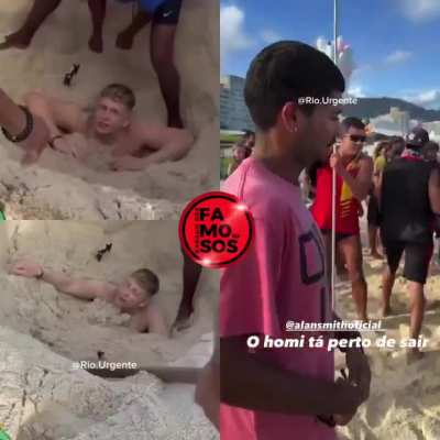 American who digged a hole in Copacabana Beach is rescued after drinking a sip of beer inside the pit