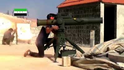 FSA Martyrs of Islam Brigade TOW ATGM hit on SAA tank within 137th Regiment positions, Western Ghouta, Syria.