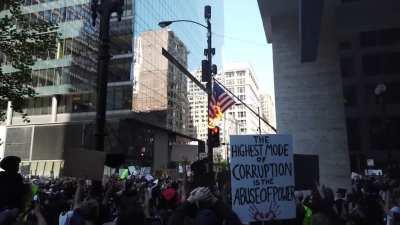 Flag Burns and Chicagoans Cheer