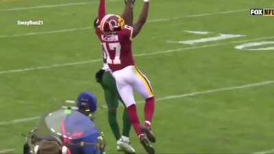 Terry McLaurin jumps over 20 feet in distance to come down with the catch