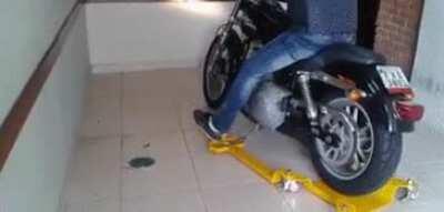Motorcycle dolly for confined spaces.