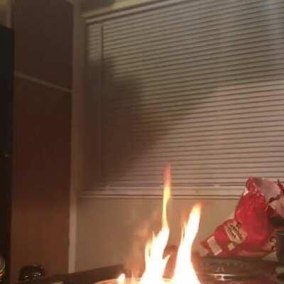 chef boyardumbass tries to put out an oil fire with water