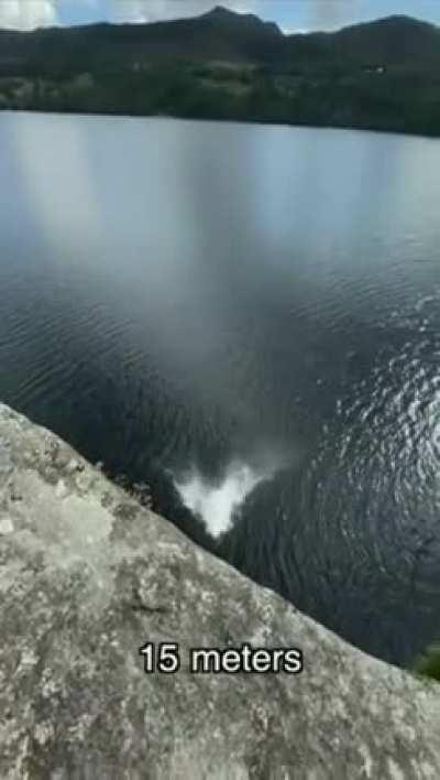 Girl jumps/flops from progressively higher platforms into bodies of water