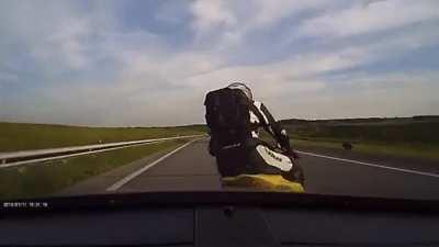 Biker brake testing a car