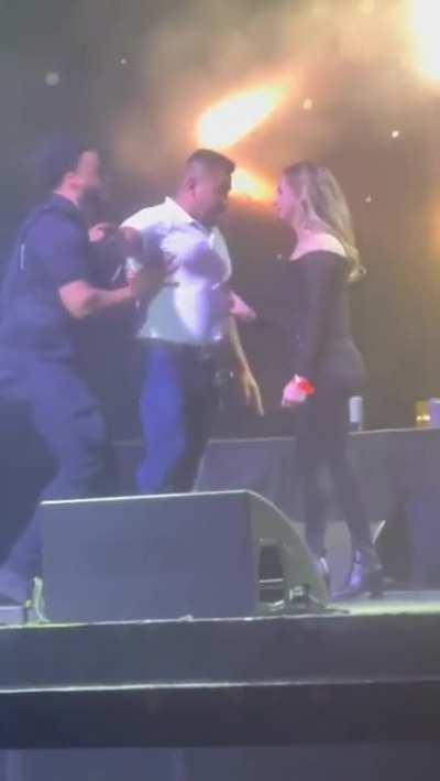 Wait! What the wife doing on stage in a full packed auditorium?!!!