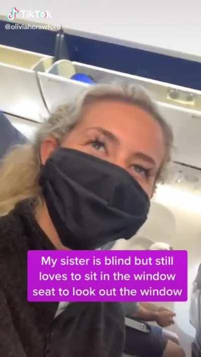 Girl shows compassion when taking care of younger sister who is blind.