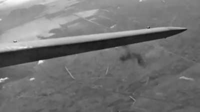 USAAF 47th BG 85th BS A-20B Havoc bombers flying through heavy flak while raiding German gun positions in Anzio on March 2nd 1944 with the camera plane's vertical tail catching fragments in the process