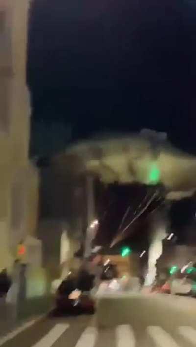 jumping off a small building with a parachute