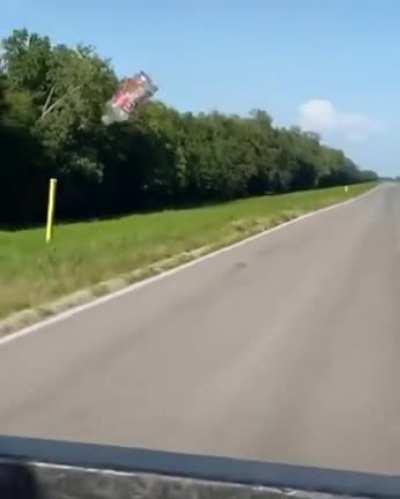 Empty bottle being dragged along behind a car due to the aerodynamic drag