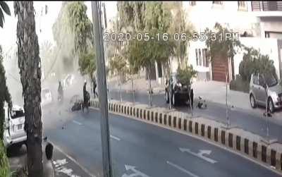 Honda goes too fast, gets hit by a Toyota and the Toyota flips over. The Honda (black car) driver died and a passenger was gravely injured. Occurred in Pakistan (Music from Source)
