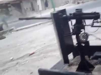 Opposition technical comes around the corner blasting during an exchange of fire with Syrian Army positions in Maarat al-Numan - 10/8/2012