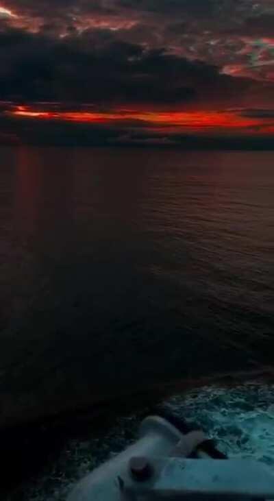 The sky turning red while sailing alone