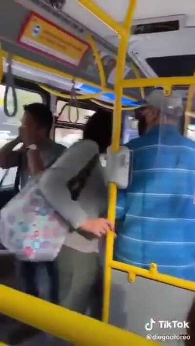 Karen spits on a man in a bus, gets what she deserves.