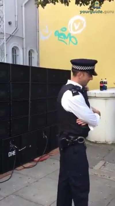 Policeman dancing at Notting Hill Carnival, London