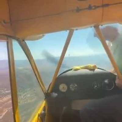 Hand starting an aircraft mid air