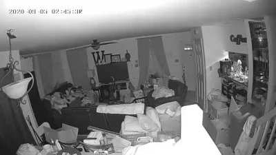 Glowing green eyes caught on Security Camera.  Ghost or human?