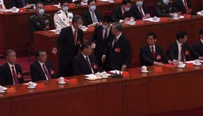 Reluctant-to-leave Former Chinese President Hu Jintao being forcefully removed from Congress in front of Xi Jinping