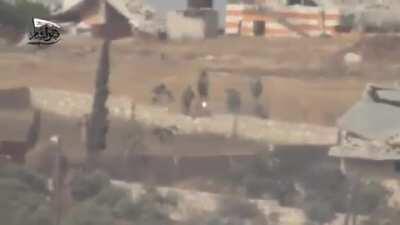 Syrian rebels blow up a group of retreating SAA soldiers with an ATGM. Aleppo, Syria 2016. NSFW