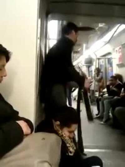 Crazy man with guitar in subway