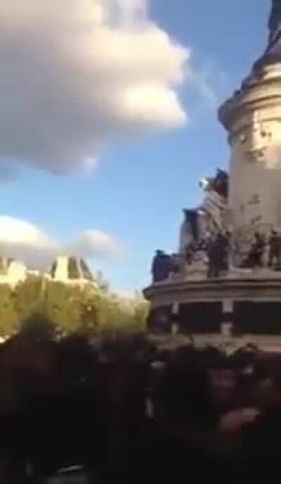 Trying to climb to the top of a statue?