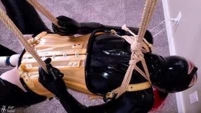 Suspended in rope & latex then forced to have increasingly stronger orgasms with a magic wand