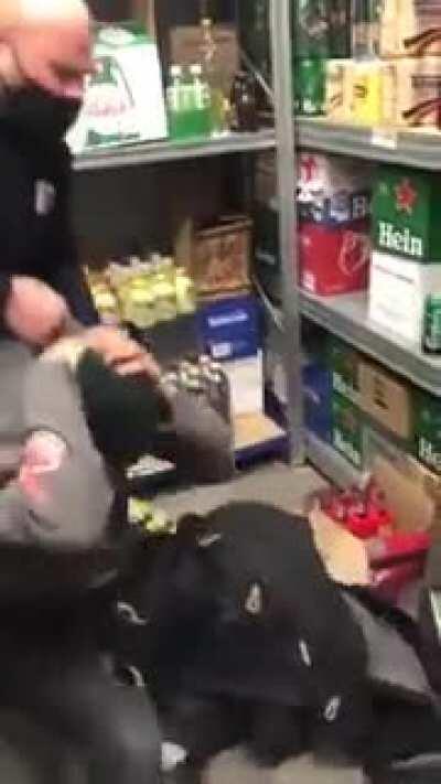 Security agents beating an thief and interrogating him about his friends that run away.