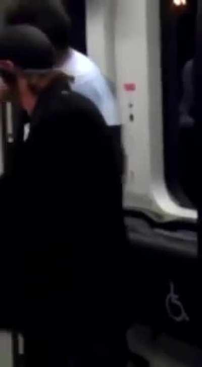 man pulls out katana while another man is being jumped