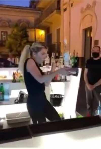 WCGR flipping and spinning heavy glass bottle of alcohol and a shaker?