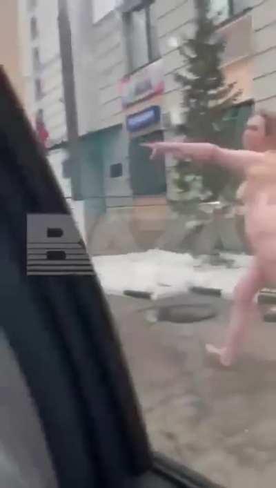 Naked woman chases police officer