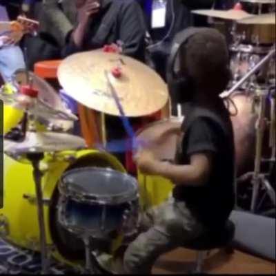 Kid playing drums
