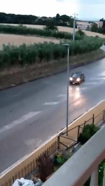 Half naked man approaches an old woman car who panics and hit italian police (Carabinieri)