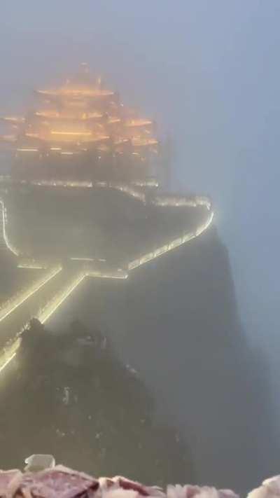 Chinese enlightenment temple seen through the fog
