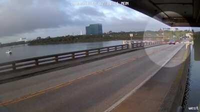 HMB while I drive through a drawbridge crossing arm and jump the bridge as it is rising into the air.