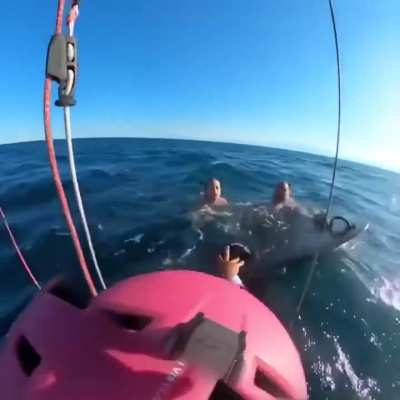 A father and daughter swept offshore in the Aegean Espanomi Bay were saved by a kite surfer.
