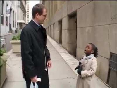Young reporter asks probing questions while on Wall Street, Questions such as: 