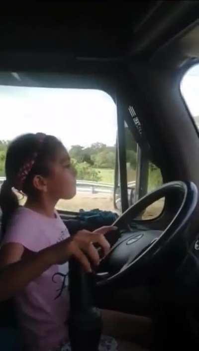 9 year old girl driving a semi on the highway